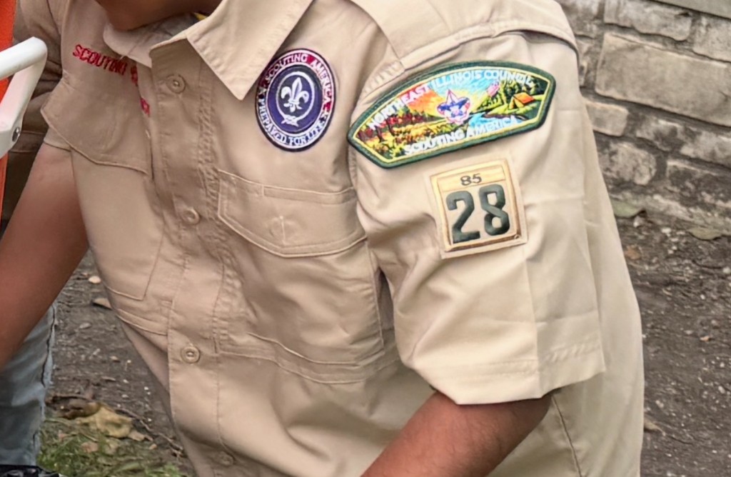 Tan Class A shirt with the Scouting America emblem, Northeast Illinois Council patch, and numerals 28