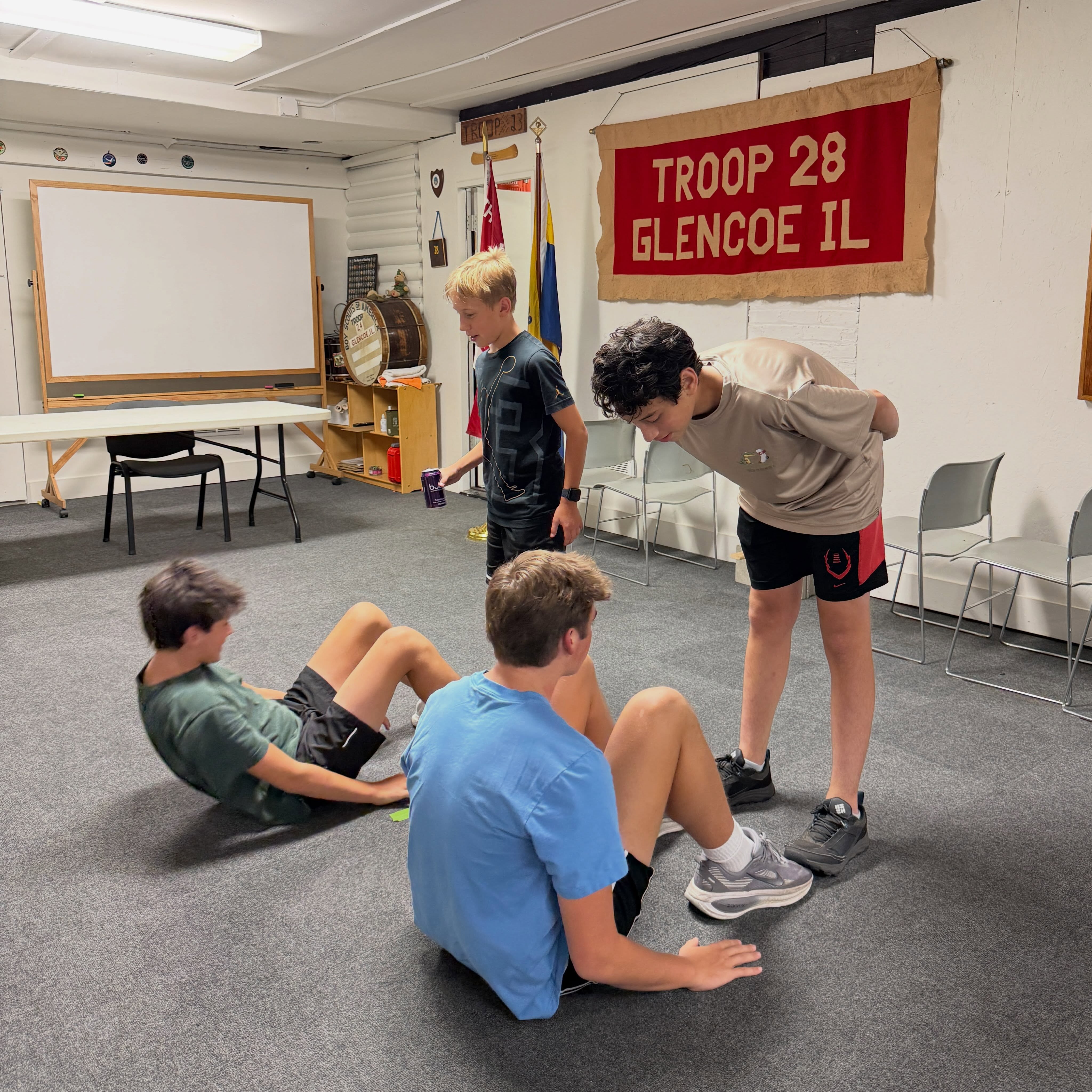 Starting the Physical Fitness merit badge — sit-ups were easier than a mile in the evening heat!