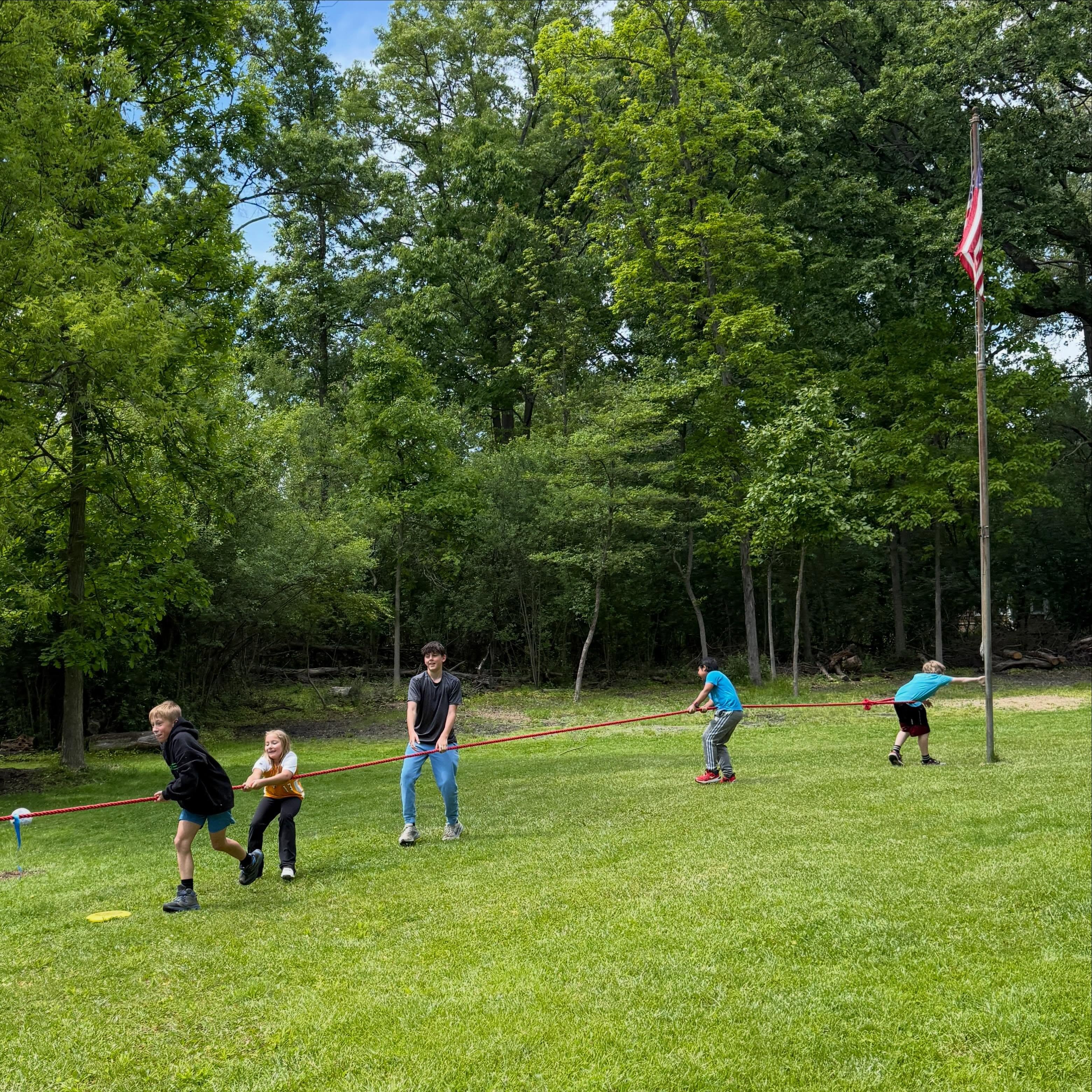 Flag pole anchor for tug of war